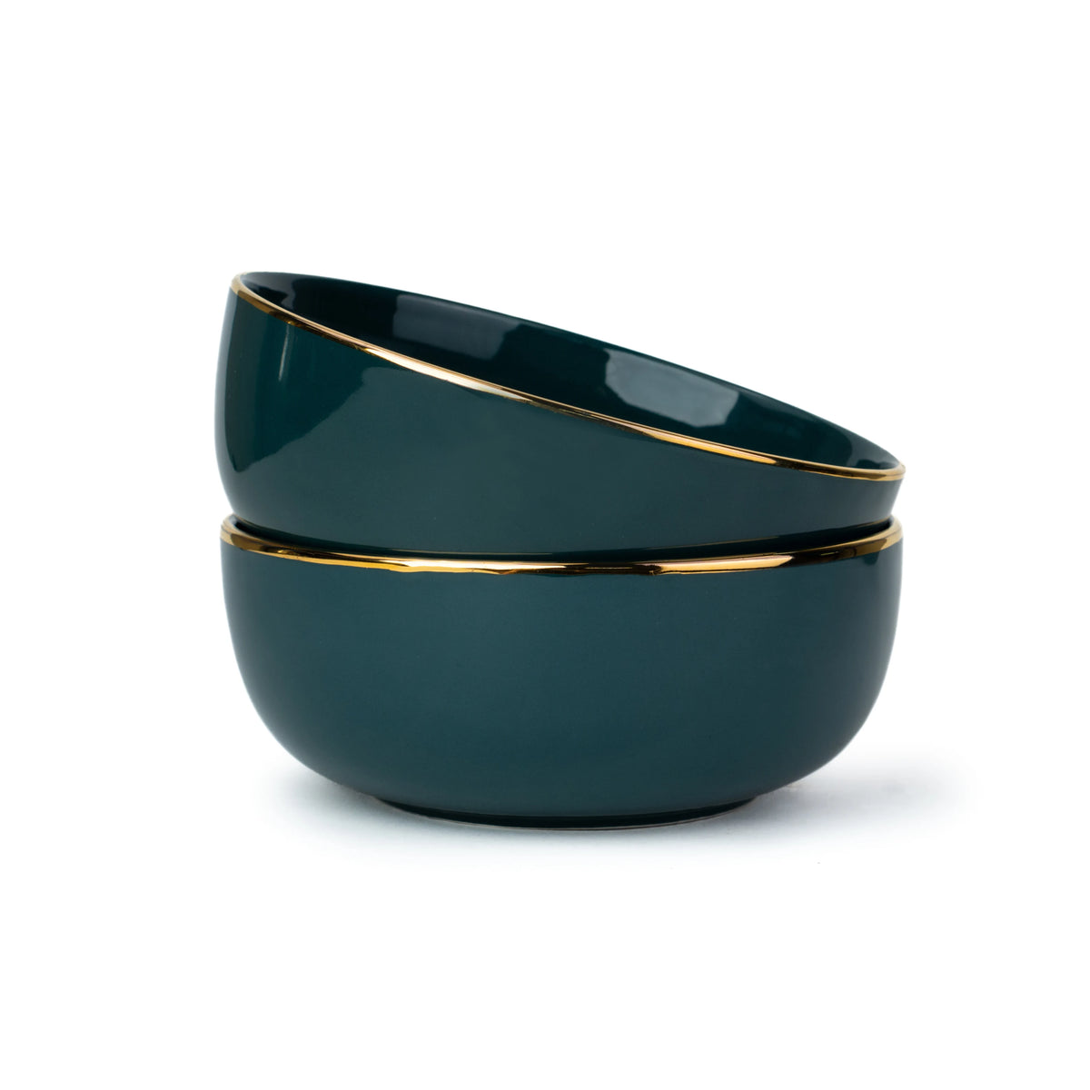 Two dark green bowls with gold rims stacked on a white background